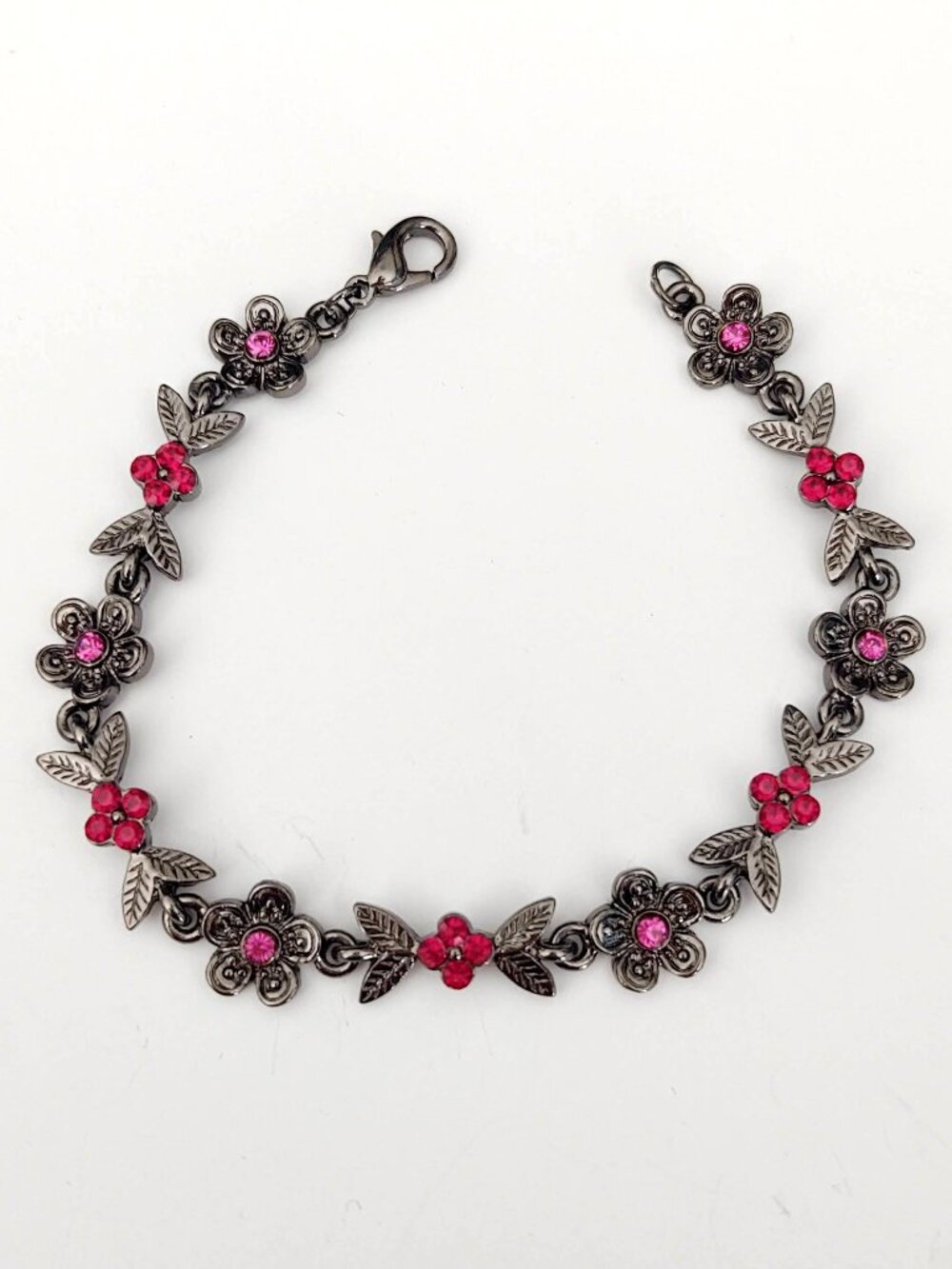 Dark metal floral bracelet w/red & pink crystals